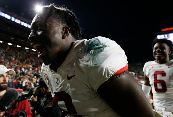 Alabama Crimson Tide linebacker Christian Harris (8) celebrates as he leaves the field after defeating the Auburn Tigers at Jordan-Hare Stadium. Alabama defeated Auburn in four overtimes